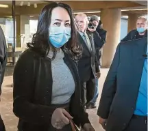  ??  ?? In the spotlight: Meng leaving the Supreme Court for a break during the hearing in Vancouver.