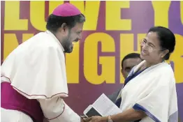  ?? — BIPLAB BANERJEE ?? West Bengal chief minister Mamata Banerjee and Catholic Bishops’ Conference of India secretary- general Reverend Theodore Mascarenha­s in New Delhi on Tuesday.