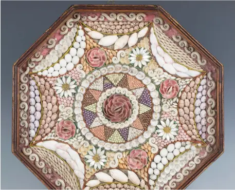  ?? ?? A 19th century sailor’s shell valentine of typical octagonal form, the glazed case enclosing a geometric pattern of various shells within coloured card borders, width 37cm © Toovey’s 2021