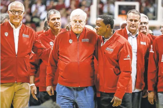  ?? PHOTOS BY MICHELLE PEMBERTON/INDYSTAR ?? Former Indiana coach Bob Knight, center left, and former Hoosiers player Isiah Thomas, center right, were among those celebrated at Assembly Hall on Feb. 8.