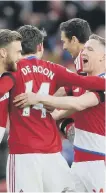  ??  ?? Boro celebrate De Roon’s goal