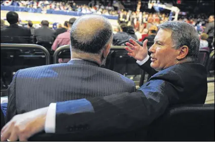  ?? BEN SOLOMON / NEW YORK TIMES ?? Big East Commission­er Mike Aresco, schmoozing with a Madison Square Garden executive during the conference basketball tournament at the New York arena last week, found himself commanding a leaking ship when he took the helm of the once mightly league...