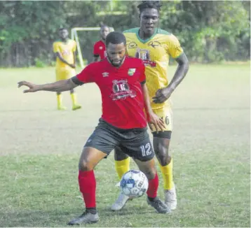  ?? (Photo: Paul Reid) ?? Action in a Jamaica Football Federation Western Conference Super League secondroun­d game between Hopewell United and Lilliput Rovers played at the UDC field last season. The game ended in a 3-3 draw.