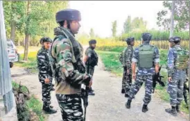  ?? ANI ?? Security personnel stand guard during an encounter, in Kulgam district South Kashmir on Tuesday.