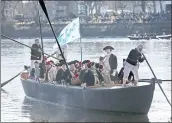  ?? MEL EVANS — THE ASSOCIATED PRESS ?? John Godzieba, as Gen. George Washington, stands in a boat Saturday during a reenactmen­t of Washington’s Christmas 1776 crossing of the Delaware River.