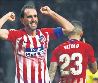  ?? REUTERS ?? ▪ Atletico Madrid's Diego Godin celebrates scoring their third goal against Bilbao on Saturday.