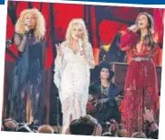  ??  ?? Karen Fairchild, Dolly Parton and Kimberly Schlapman performed at the Grammys at a tribute to the veteran country music singer