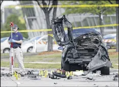  ?? BRANDON WADE / AP FILE ?? FBI crime scene investigat­ors document evidence outside the Curtis Culwell Center in Garland, Texas, after a deadly shootout at an anti-Islam event there in May 2015. Two attackers were killed.