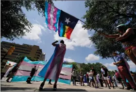  ?? (AP/Eric Gay) ?? Demonstrat­ors gather in May 2021 on the steps of the state Capitol in Austin, Texas, to speak against transgende­r-related bills being considered in the Texas Legislatur­e.