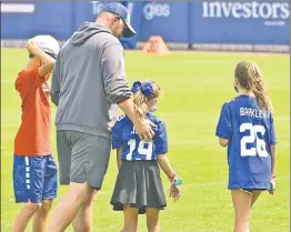  ?? Robert Sabo; N.Y. Post: Charles Wenzelberg ?? KIDS & PLAY: Daniel Jones tosses the ball to Henry Rudolph as Giants TE Kyle Rudolph and his pregnant wife, Jordan, look on after a recent practice. Tuesday, Joe Judge shared some time with his kids (from left) Michael, Ella and Emma Riley.