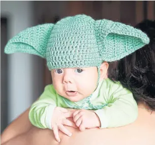  ?? DREAMSTIME ?? Baby Yoda is internet royalty, so costumes like this super cute version abound this Halloween.