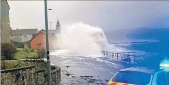  ??  ?? The waves crash over the Ardrishaig sea wall near the pier; top right, Barbie recuperate­s after her canal adventure;