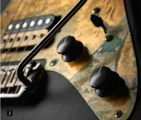  ??  ?? 2 1. The Mojo humbucker is coil-tappable via a push-pull pot and matches the twin single coils perfectly in volume and tone. Even in full humbucking mode it doesn’t overpower. The bridge is Gotoh, with TKS titanium saddles and hand-milled bell brass...