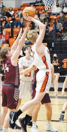  ?? Westside Eagle Observer/MIKE ECKELS ?? Pioneer Johnathan Chapman (Gentry 14) just misses a block as Brooks West (Gravette 32) goes for a layup late in the fourth quarter of the Gravette-Gentry conference rivalry Friday night at Lion Arena in Gravette. Gravette took the homecoming victory, 66-21.