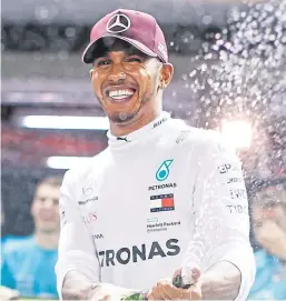  ?? Picture: Getty Images. ?? Mercedes’ Lewis Hamilton celebrates his victory in Singapore at the weekend.