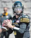  ?? PETER MCCABE THE CANADIAN PRESS ?? Johnny Manziel looks for an open receiver during a pre-season game against the Alouettes in Montreal on Saturday.