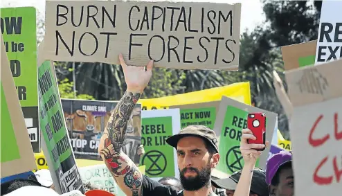  ?? Picture: Thapelo Morebudi ?? Protesters in Johannesbu­rg joined millions of marchers around the world calling for urgent action on climate breakdown in Friday’s global climate strike.