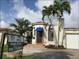  ?? WILFREDO LEE — THE ASSOCIATED PRESS ?? A home for sale in Surfside, Fla. U.S. home prices jumped by the most in more than seven years in March, as an increasing number of would-be buyers compete for a dwindling supply of houses. The March S&P CoreLogic Case-Shiller 20-city home price index, released Tuesday rose 13.3% from a year earlier, the biggest gain since December 2013.
