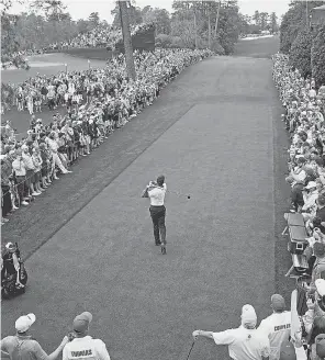  ?? ROB SCHUMACHER/ USA TODAY SPORTS ?? Tiger Woods tees off on the 18th hole during a practice round Wednesday at Augusta National Golf Club.