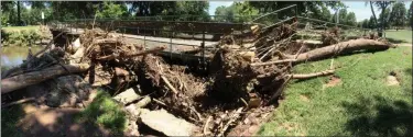  ?? EVAN BRANDT — MEDIANEWS GROUP ?? A wider look at the debris piled up against the pedestrian bridge in Memorial Park.