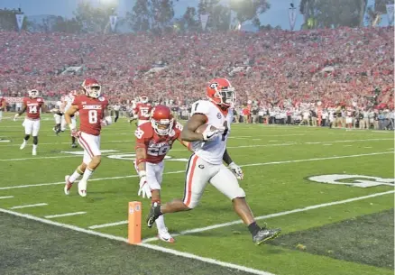  ?? JOHN KELLEY/GEORGIA PHOTO ?? Georgia senior tailback Sony Michel scores one of his three touchdowns during Monday’s 54-48 win over Oklahoma in double overtime at the Rose Bowl.