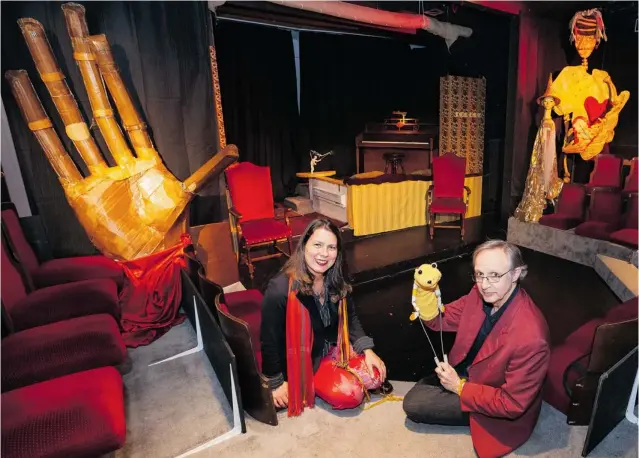  ?? PHOTOS: DEBRA BRASH/ TIMES COLONIST FILES ?? Actors Petra Kixmoeller and Tim Gosley in the theatre of their Vancouver Island home. Gosley holds a Muppet from his early career, while at left is a giant cardboard hand he made. It matches one by the front door. The theatre takes up most of the first...