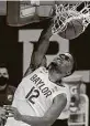  ?? Jerry Larson / Associated Press ?? Jared Butler slams down a dunk for two of his 22 points in Baylor’s victory.