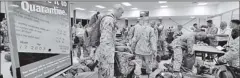  ??  ?? United States Marines complete quarantine checks as they arrive at a Royal Australian Air Force Base in Darwin on April 4. Reuters.