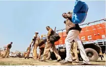  ??  ?? Policemen leave for their allotted polling stations on the eve of fourth phase of polling for UP Assembly elections in Allahabad on Wednesday