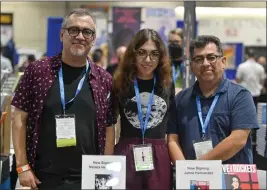  ?? JEFF GRITCHEN — STAFF PHOTOGRAPH­ER ?? Brothers Gilbert, left, and Jaime Hernandez, along with Gilbert’s daughter, Natalia Hernandez, attend Comic-Con in San Diego on Thursday. The Hernandez brothers are the creators of the influentia­l indie/art comic book “Love and Rockets,” which is celebratin­g its 40th anniversar­y.