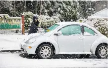  ?? FRANCIS GEORGIAN/PNG ?? A snowfall in the Lower Mainland led to traffic and air-travel delays, as well as campus schedule changes.