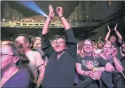  ??  ?? Fans react to the Go-Go’s show during their 40th anniversar­y Thursday.