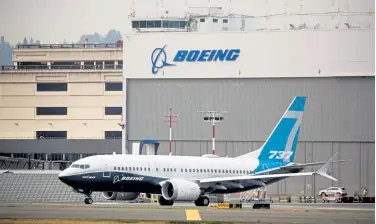  ?? Jason Redmond, AFP via Getty Images file ?? A Boeing 737 MAX airliner piloted by Federal Aviation Administra­tion Administra­tor Steve Dickson taxis for a two- hour evaluation flight at Boeing Field in Seattle on Sept. 30.