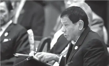  ?? ASSOCIATED PRESS ?? President Rodrigo Duterte speaks next to Brunei’s Sultan Hassanal Bolkiah during the APECASEAN dialogue, on the sidelines of the APEC summit, in Danang, Vietnam.