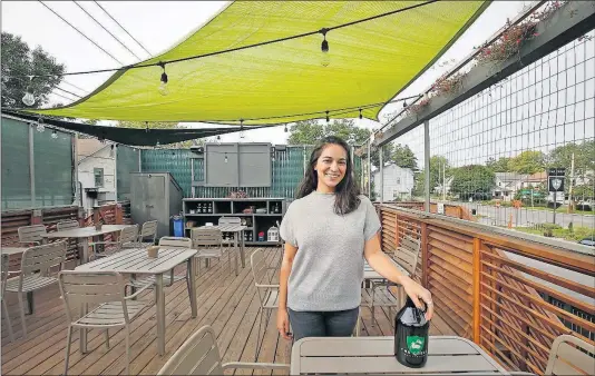  ?? DISPATCH] [TOM DODGE/ ?? Nohal Alshahal, managing partner of the Crest Gastropub, shows off the rooftop dining space at 2855 Indianola Ave. in Clintonvil­le.