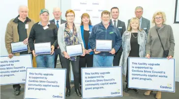  ??  ?? At the presentati­on of Cardinia Shire’s community capital works grants are (from left) Ross Housham of Gemco Player Community Theatre, Andrew Chatfield of Cora Lynn Recreation Reserve, Cr Graeme Moore, Wendy Lindrea of Emerald Arts Society, Cr Leticia Wilmot, Damian Brick of Garfield Bowls Club, Cr Brett Owen, Cr Carol Ryan, Cr Ray Brown and Kay Frith of Emerald Arts Society.