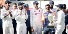  ??  ?? Indian cricket team captain Virat Kohli holds the trophy after defeating England during the third day’s play of the 4th and last Test match of the series at Narendra Modi Stadium in Ahmedabad, on Saturday