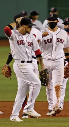  ?? Stuart CaHIll / Herald staFF ?? STARTING OFF ON THE RIGHT NOTE: Michael Chavis does a dance after the final out as the Red Sox defeated the Orioles on Opening Day at Fenway Park on Friday.