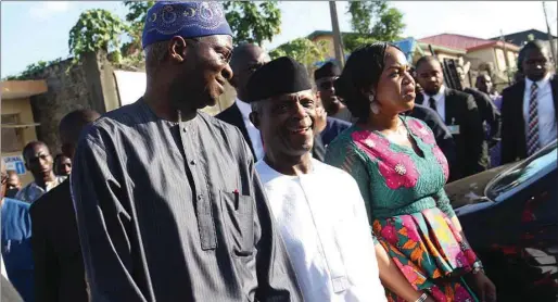  ??  ?? The vice president and Fashola takes a stroll around Sura's shops