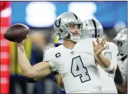  ?? MARK J. TERRILL/THE ASSOCIATED PRESS, FILE ?? Las Vegas Raiders quarterbac­k Derek Carr throws a pass duringa game against the Los Angeles Rams on Dec. 8, 2022, in Inglewood, Calif.