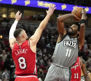  ?? Charles Rex Arbogast/Associated Press ?? With Kyrie Irving on the road Wednesday night in Chicago, the Nets routed the Bulls, 138-112. Without him a night later at home, they lost to Oklahoma City, 130-109.