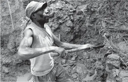 ??  ?? A Congolese miner digs for cassiterit­e, the major ore of tin, in eastern Democratic Republic of Congo.