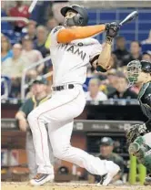  ?? LYNNE SLADKY/AP ?? Giancarlo Stanton, tracks his two-run home run during the fifth inning on Tuesday in Miami.