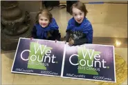  ?? ASSOCIATED PRESS FILE PHOTO ?? Noelle Fries, 6, left, and Galen Biel, 6, both of Minneapoli­s, attend a rally at the Minnesota Capitol to kick off a yearlong drive to try to ensure that all Minnesota residents are counted in the 2020 census, in 2019.