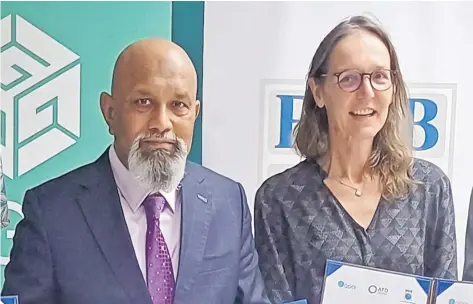  ?? Picture: TIMOCI VULA ?? Fiji Developmen­t Bank CEO Saud Minam and AFD Regional director Pacific Oceans Virginie Bleitrach in Suva on Wednesday.