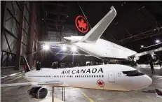  ?? THE CANADIAN PRESS ?? Air Canada has spent billions in recent years upgrading its fleet and adding to routes. Above, one of its Boeing 787-8s.