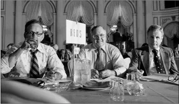  ?? HARRY HARRIS — THE ASSOPCIATE­D PRESS FILE ?? In this Nov. 4, 1977, file photo, Bob Howsam, center, president of the former world champion Cincinnati Reds, smiles during the free agent re-entry draft in New York. Reds vice president of administra­tion, Dick Wagner, is at right. Person at left is unidentifi­ed. Baseball’s amateur draft this week will look much different because of the coronaviru­s pandemic, and more permanent changes could be coming soon.