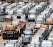  ??  ?? A truck drives past rolls of steel inside the China Steel Corporatio­n factory. Regulators argue that Beijing has not done enough to curb its subsidies.