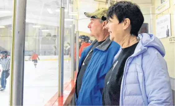  ?? KATHY JOHNSON ■ SALTWIRE FILE ?? David and Louann Link watch a memorial charity hockey game in their son Jevon’s honour at the Sandy Wickens Memorial Arena in March 2022. More than $15,000 was raised at the game in support of the Let Your Light Shine Jevon Link Society, whose goal is for mental health care to be available in the community.
