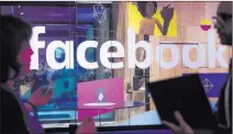  ?? Noah Berger ?? The Associated Press file Facebook is being hit with a fine of $663,000, which the company generates roughly every seven minutes, based on its first-quarter revenue of $11.97 billion.